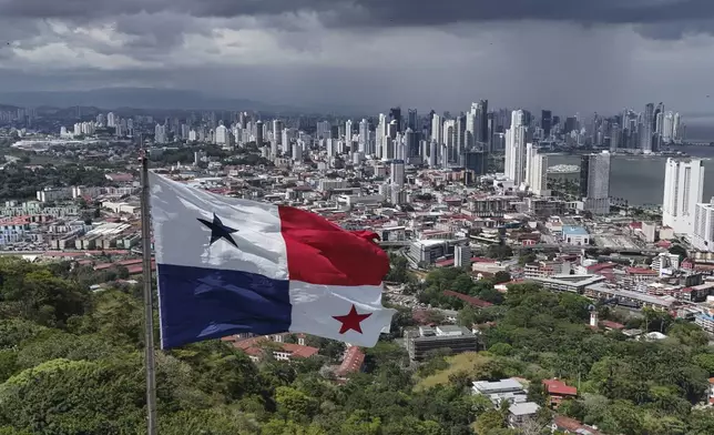 A Panamanian flag flies on Ancon hill backdropped by the skyline of Panama City, Thursday, May 2, 2024. Panamanians will elect a new president on May 5th. (AP Photo/Matias Delacroix)
