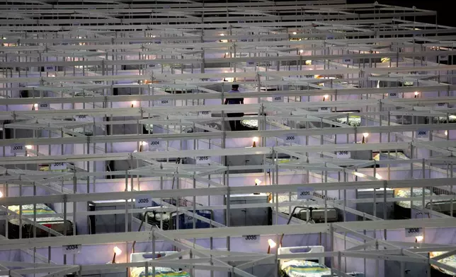 FILE - Hundreds of beds are lined up at a temporary field hospital set up at the Asia World Expo in Hong Kong, Saturday, Aug. 1, 2020. (AP Photo/Kin Cheung, File)