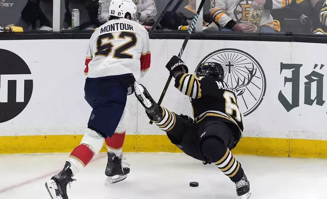 Florida Panthers' Brandon Montour (62) checks Boston Bruins' Brad Marchand (63) during the second period in Game 6 of an NHL hockey Stanley Cup second-round playoff series Friday, May 17, 2024, in Boston. (AP Photo/Michael Dwyer)