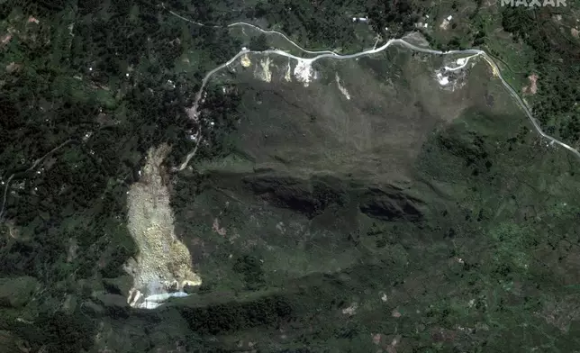 This May 27, 2024, satellite image provided by Maxar Technologies shows the recent landslide in the Enga region of northern Papua New Guinea that killed and wounded hundreds of people and buried part of the Yambali village. (Maxar Technologies via AP)