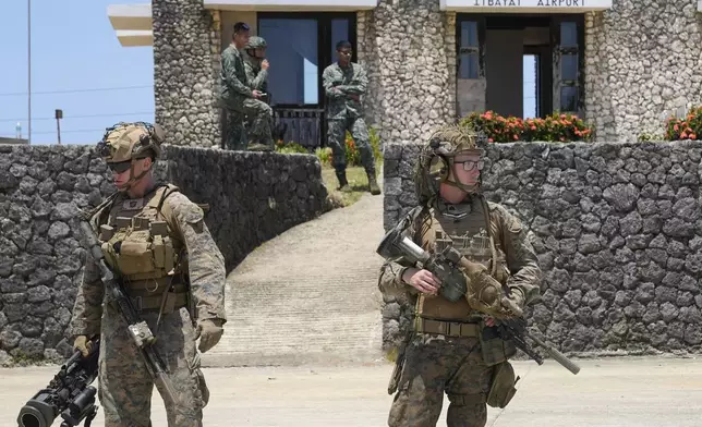 U.S. troopers secure an airport at the Philippines' northernmost town of Itbayat, Batanes province during a joint military exercise on Monday, May 6, 2024. American and Filipino marines held annual combat-readiness exercises called Balikatan, Tagalog for shoulder-to-shoulder, in a show of allied battle readiness in the Philippines' northernmost island town of Itbayat along the strategic Bashi Channel off southern Taiwan. (AP Photo/Aaron Favila)