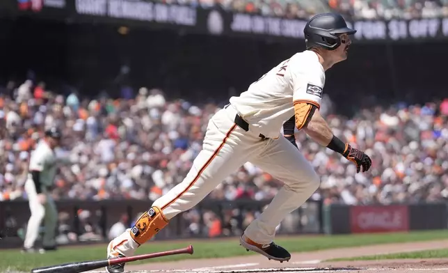 San Francisco Giants' Mike Yastrzemski watches his two-run double during the second inning of a baseball game against the Philadelphia Phillies in San Francisco, Monday, May 27, 2024. (AP Photo/Jeff Chiu)