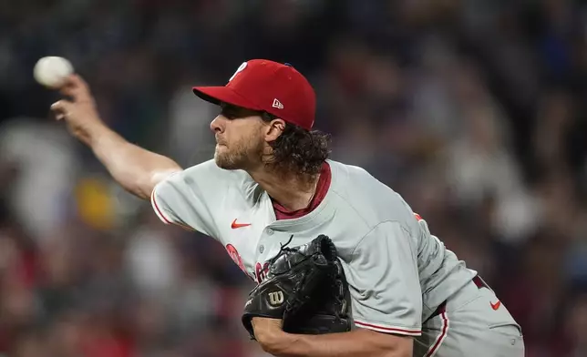 Philadelphia Phillies starting pitcher Aaron Nola works against the Colorado Rockies in the third inning of a baseball game Saturday, May 25, 2024, in Denver. (AP Photo/David Zalubowski)