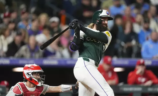 Colorado Rockies' Charlie Blackmon grounds out against the Philadelphia Phillies during the fifth inning of a baseball game Saturday, May 25, 2024, in Denver. (AP Photo/David Zalubowski)