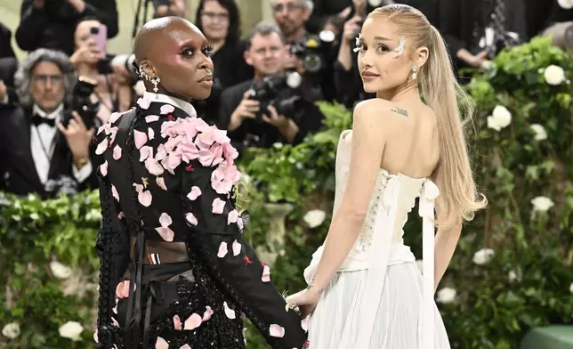 Cynthia Erivo, left, and Ariana Grande attend The Metropolitan Museum of Art's Costume Institute benefit gala celebrating the opening of the "Sleeping Beauties: Reawakening Fashion" exhibition on Monday, May 6, 2024, in New York. (Photo by Evan Agostini/Invision/AP)