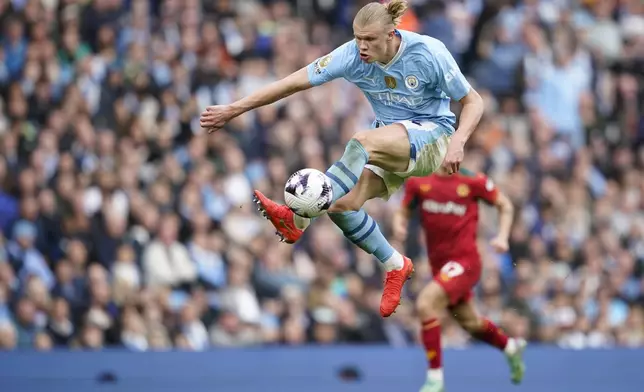 Manchester City's Erling Haaland is in action during the English Premier League soccer match between Manchester City and Wolverhampton Wanderers at the Etihad Stadium in Manchester, England, Saturday, May 4, 2024. (AP Photo/Dave Thompson)