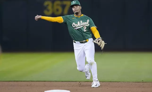 Oakland Athletics shortstop Darell Hernaiz throws out Pittsburgh Pirates' Joey Bart at first base during the fifth inning of a baseball game in Oakland, Calif., Tuesday, April 30, 2024. (AP Photo/Jeff Chiu)