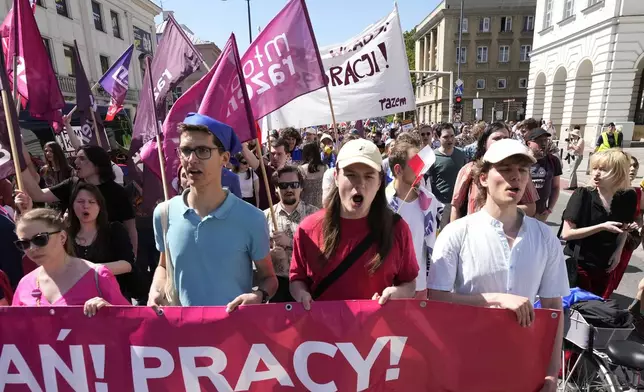 Supporters of a left-wing party march, to mark the Labor Day holiday in support of workers' rights, in Warsaw, Poland, on May 1, 2024. (AP Photo/Czarek Sokolowski)