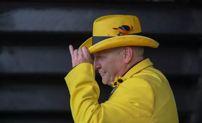 Andy Blair, of Louisville, Ky,. looks on ahead of the Black-Eyed Susan horse race at Pimlico Race Course, Friday, May 17, 2024, in Baltimore. (AP Photo/Nick Wass)