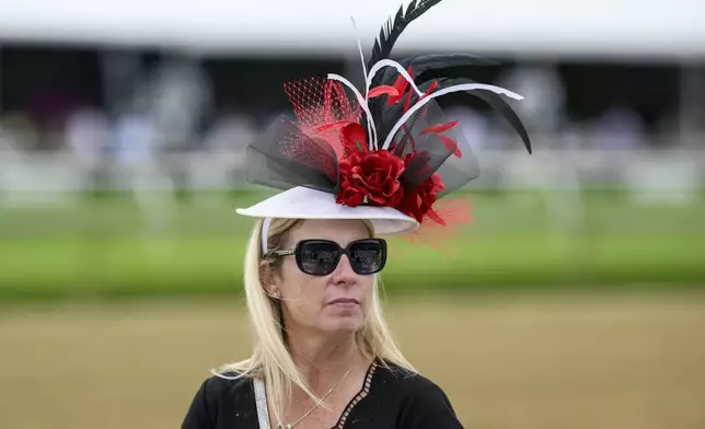 Jennifer Cobb, of Chesapeake, Va., looks on ahead of the Black-Eyed Susan horse race at Pimlico Race Course, Friday, May 17, 2024, in Baltimore. (AP Photo/Nick Wass)