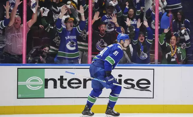 Vancouver Canucks' Nikita Zadorov celebrates his goal against the Nashville Predators during the third period in Game 5 of an NHL hockey Stanley Cup first-round playoff series, in Vancouver, British Columbia, on Tuesday, April 30, 2024. (Darryl Dyck/The Canadian Press via AP)