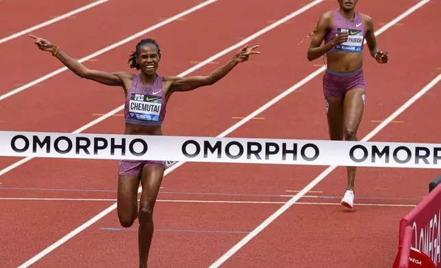 Peruth Chemutai, of Uganda, wins the women's steeplechase at the Prefontaine Classic track and field meet Saturday, May 25, 2024, in Eugene, Ore. (AP Photo/Thomas Boyd)
