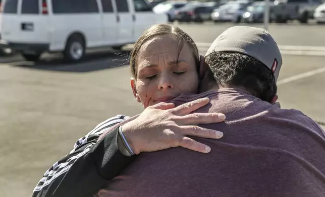 Crystal Allen embraces her son, Martin Allen, upon her release from the Arizona State Prison Complex – Perryville in Goodyear, Ariz., April 18, 2023. Though prisoners working for private companies often are paid minimum wage, some state corrections departments and their prison industries' arms garnish more than 60 percent of workers' earnings. (AP Photo/Dario Lopez-Mills)