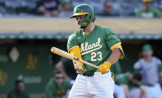 Oakland Athletics' Shea Langeliers reacts after striking out with the bases loaded to end the sixth inning in the second baseball game of the team's doubleheader against the Texas Rangers, Wednesday, May 8, 2024, in Oakland, Calif. (AP Photo/Godofredo A. Vásquez)