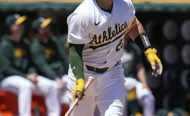 Oakland Athletics' Shea Langeliers watches his two-run home run against the Texas Rangers during the second inning in the first baseball game of a doubleheader Wednesday, May 8, 2024, in Oakland, Calif. (AP Photo/Godofredo A. Vásquez)