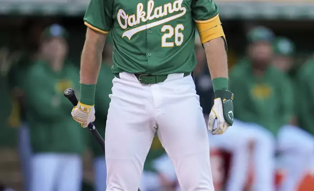 Oakland Athletics' Tyler Nevin reacts to being called out on strikes during the eighth inning in the second baseball game of the team's doubleheader against the Texas Rangers, Wednesday, May 8, 2024, in Oakland, Calif. (AP Photo/Godofredo A. Vásquez)