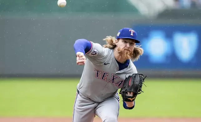 Texas Rangers' pitcher Jon Gray throws during the first inning of a baseball game against the Texas Rangers, Sunday, May 5, 2024, in Kansas City, Mo. (AP Photo/Nick Tre. Smith)