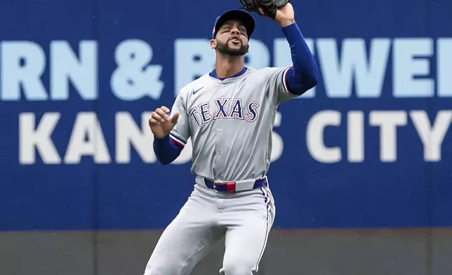 Texas Rangers' outfielder Leody Taveras catches a ball or an out during the first inning of a baseball game against the Kansas City Royals, Sunday, May 5, 2024, in Kansas City, Mo. (AP Photo/Nick Tre. Smith)