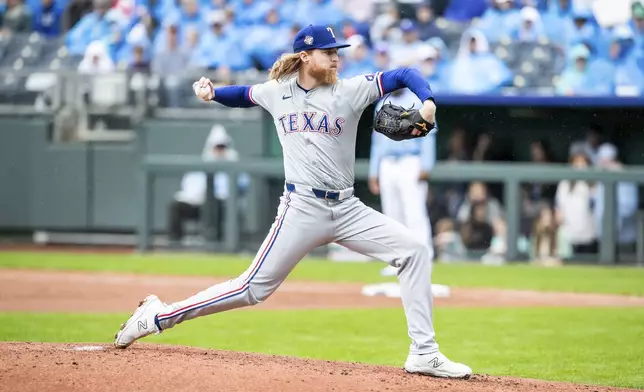 Texas Rangers' pitcher Jon Gray pitches the ball during the first inning of a baseball game against the Kansas City Royals, Sunday, May 5, 2024, in Kansas City, Mo. (AP Photo/Nick Tre. Smith)