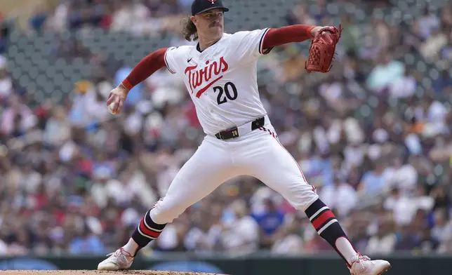 Minnesota Twins starting pitcher Chris Paddack (20) delivers during the second inning of a baseball game against the Texas Rangers, Saturday, May 25, 2024, in Minneapolis. (AP Photo/Abbie Parr)