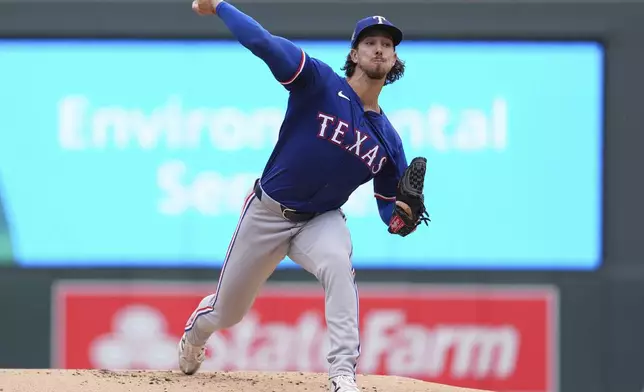 Texas Rangers starting pitcher Michael Lorenzen delivers during the first inning of a baseball game against the Minnesota Twins, Saturday, May 25, 2024, in Minneapolis. (AP Photo/Abbie Parr)