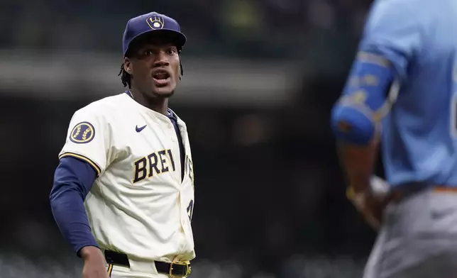 Milwaukee Brewers' Abner Uribe, left, and Tampa Bay Rays' Jose Siri exchange words during the eighth inning of a baseball game Tuesday, April 30, 2024, in Milwaukee. (AP Photo/Aaron Gash)