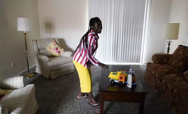 Congo refugee Riziki Kashindi tours her new apartment, Thursday, April 11, 2024, in Columbia, S.C. The American refugee program, which long served as a haven for people fleeing violence around the world, is rebounding from years of dwindling arrivals under former President Donald Trump. The Biden administration has worked to restaff refugee resettlement agencies and streamline the process of vetting and placing people in America. (AP Photo/Erik Verduzco)