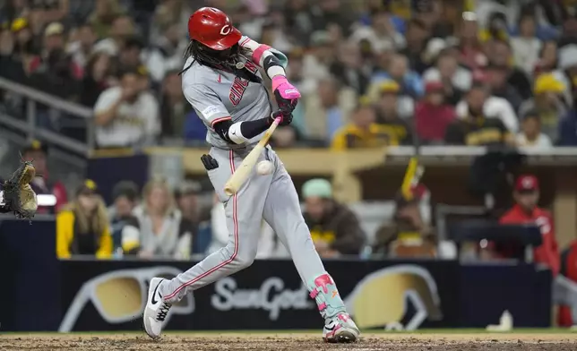 Cincinnati Reds' Elly De La Cruz hits a single during the sixth inning of a baseball game against the San Diego Padres, Tuesday, April 30, 2024, in San Diego. (AP Photo/Gregory Bull)