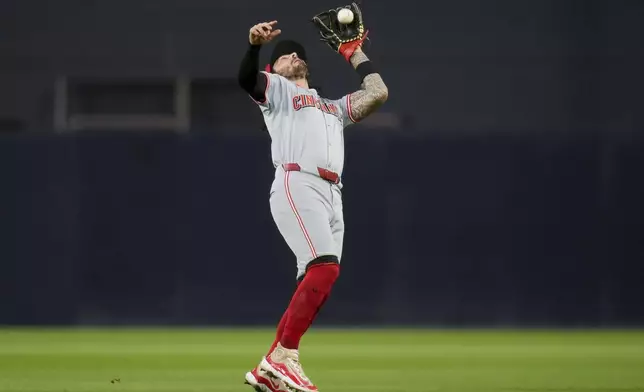 Cincinnati Reds second baseman Jonathan India makes a catch for the out on San Diego Padres' Ha-Seong Kim during the fourth inning of a baseball game, Tuesday, April 30, 2024, in San Diego. (AP Photo/Gregory Bull)