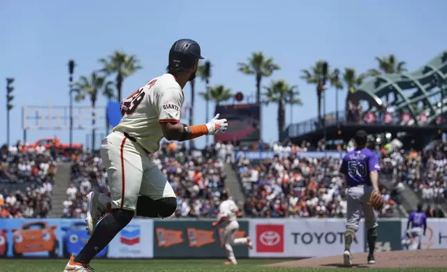San Francisco Giants' Luis Matos runs the bases after hitting a three-run home run against Colorado Rockies pitcher Ty Blach (50) during the first inning of a baseball game Saturday, May 18, 2024, in San Francisco. (AP Photo/Godofredo A. Vásquez)