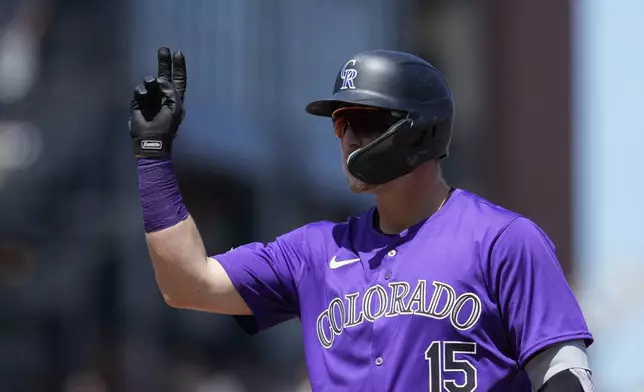 Colorado Rockies' Hunter Goodman reacts after hitting an RBI single against the San Francisco Giants during the sixth inning of a baseball game Saturday, May 18, 2024, in San Francisco. (AP Photo/Godofredo A. Vásquez)