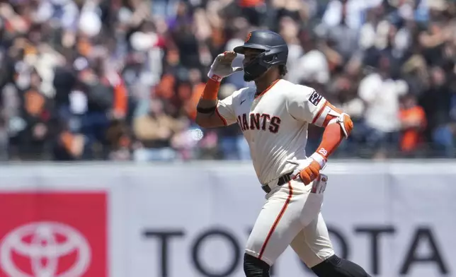San Francisco Giants' Luis Matos runs the bases after hitting a three-run home run against Colorado Rockies pitcher Ty Blach during the first inning of a baseball game Saturday, May 18, 2024, in San Francisco. (AP Photo/Godofredo A. Vásquez)