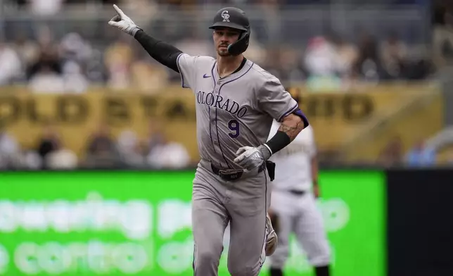 Colorado Rockies' Brenton Doyle celebrates after hitting a home run during the second inning of a baseball game against the San Diego Padres, Wednesday, May 15, 2024, in San Diego. (AP Photo/Gregory Bull)