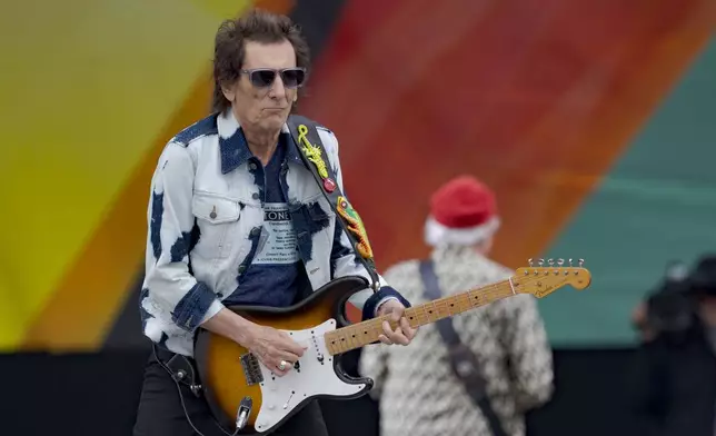 Ronnie Wood, of the Rolling Stones, performs during the New Orleans Jazz and Heritage Festival in New Orleans, Thursday, May 2, 2024. (AP Photo/Matthew Hinton)