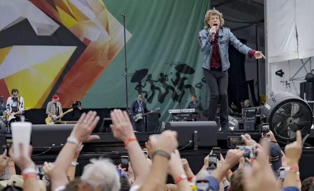 Mick Jagger, right, Ronnie Wood, left, and Keith Richards, of the Rolling Stones, perform during the New Orleans Jazz and Heritage Festival in New Orleans, Thursday, May 2, 2024. (AP Photo/Matthew Hinton)