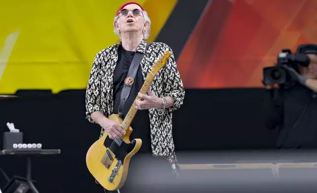 Keith Richards, of the Rolling Stones, performs during the New Orleans Jazz and Heritage Festival in New Orleans, Thursday, May 2, 2024. (AP Photo/Matthew Hinton)