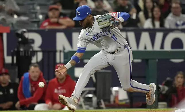 Kansas City Royals third baseman Maikel Garcia fields a ball hit by Los Angeles Angels' Zach Neto during the seventh inning of a baseball game Thursday, May 9, 2024, in Anaheim, Calif. Neto was safe at first on the play. (AP Photo/Mark J. Terrill)