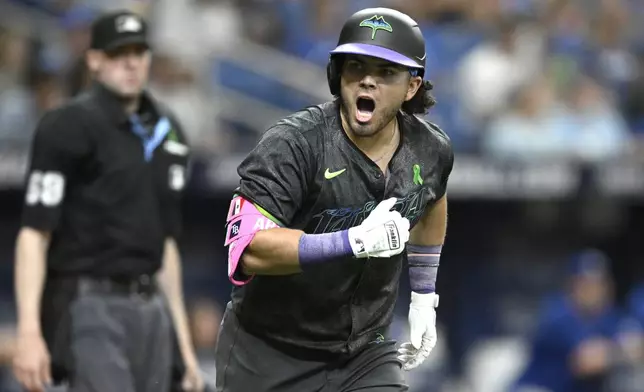 Tampa Bay Rays' Jonathan Aranda (62) reacts after hitting a solo home run during the fourth inning of a baseball game against the Kansas City Royals, Saturday, May 25, 2024, in St. Petersburg, Fla. (AP Photo/Phelan M. Ebenhack)