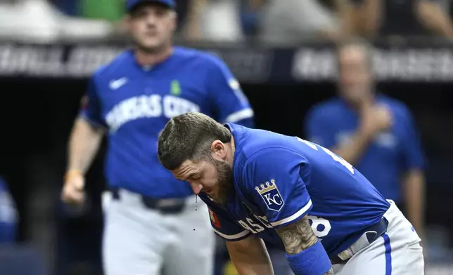 Blood drips from Kansas City Royals' Kyle Isbel's face after being hit by his own fouled ball during the seventh inning of a baseball game against the Tampa Bay Rays, Saturday, May 25, 2024, in St. Petersburg, Fla. (AP Photo/Phelan M. Ebenhack)
