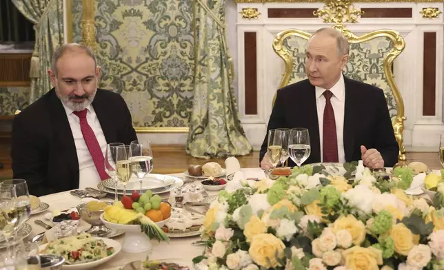 Armenian Prime Minister Nikol Pashinyan, left, and Russian President Vladimir Putin attend a working dinner following a meeting of the Eurasian Economic Union at the Kremlin in Moscow, Russia, on Wednesday, May 8, 2024. Russian President Vladimir Putin hailed the economic alliance's performance, saying that it helped boost the members' economic potential. (Alexander Kazakov, Sputnik, Kremlin Pool Photo via AP)