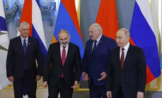 Cuban President Miguel Diaz-Canel, left, Armenian Prime Minister Nikol Pashinyan, second left, Belarusian President Alexander Lukashenko, second right, and Russian President Vladimir Putin pose for a photo during a meeting of the Eurasian Economic Union at the Kremlin in Moscow, Russia, on Wednesday, May 8, 2024. Russian President Vladimir Putin hailed the economic alliance's performance, saying that it helped boost the members' economic potential. (Evgenia Novozhenina/Pool Photo via AP)
