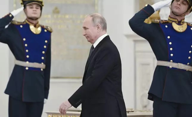 FILE - Russian President Vladimir Putin arrives at a ceremony to present medals on the eve of Heroes of the Fatherland Day at St. George Hall of the Grand Kremlin Palace, in Moscow, Russia, Friday, Dec. 8, 2023. Putin seems to be hoping that relentless military pressure, changing Western political dynamics and a global focus on the war in Gaza will drain support for Ukraine. (Sergei Guneyev, Sputnik, Kremlin Pool Photo via AP, File)