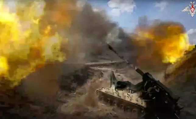 FILE - In this photo taken from video released by the Russian Defense Ministry Press Service on May 18, 2023, a Russian 152 mm self-propelled gun fires toward Ukrainian positions at an undisclosed location. The Russian military has pressed attacks in several sectors in Ukraine a bid to drain Kyiv's reserves and deplete its munitions. (Russian Defense Ministry Press Service via AP, File)