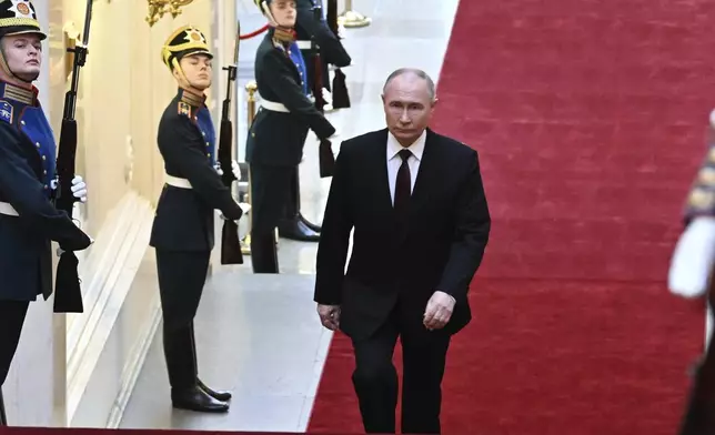 Russian President Vladimir Putin arrives for an inauguration ceremony to begin his fifth term as Russian president in the Grand Kremlin Palace in Moscow, Russia, Tuesday, May 7, 2024. (Alexey Maishev, Sputnik, Kremlin Pool Photo via AP)