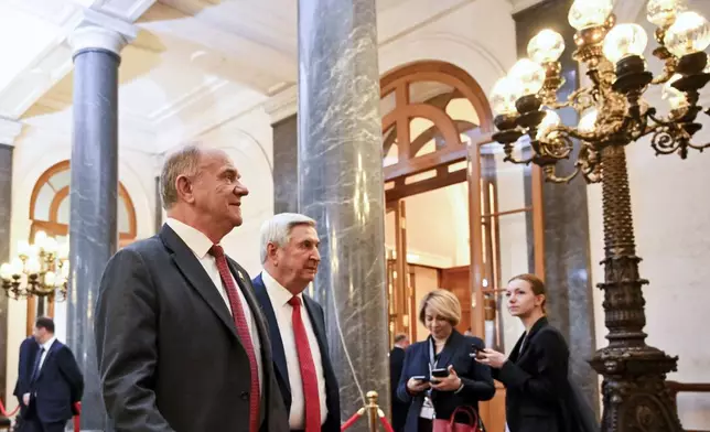 Russian Communist leader Gennady Zyuganov, left, and deputy chairman of the Communist party Ivan Melnikov arrive for Russia's president-elect Vladimir Putin inauguration ceremony in the Grand Kremlin Palace in Moscow, Russia, Tuesday, May 7, 2024. (Alexander Nemenov/Pool Photo via AP)