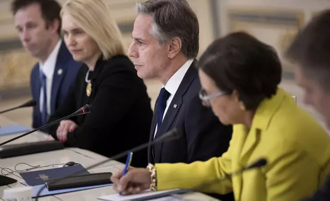 U.S. Secretary of State Antony Blinken, center, attends a meeting with Ukraine's President Volodymyr Zelenskyy in Kyiv, Ukraine, Tuesday, May 14, 2024. Blinken arrived in Kyiv on Tuesday in an unannounced diplomatic mission to reassure Ukraine that it has American support as it struggles to defend against increasingly intense Russian attacks. (Brendan Smialowski/Pool Photo via AP)