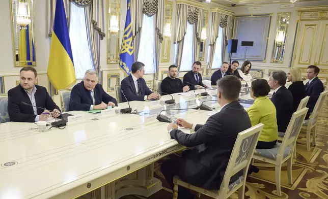 In this photo provided by the Ukrainian Presidential Press Office, Ukraine's President Volodymyr Zelenskyy, fourth left, speaks during a meeting with U.S. Secretary of State Antony Blinken, third right, in Kyiv, Ukraine, Tuesday, May 14, 2024. Blinken arrived in Kyiv on Tuesday in an unannounced diplomatic mission to reassure Ukraine that it has American support as it struggles to defend against increasingly intense Russian attacks. (Ukrainian Presidential Press Office via AP)