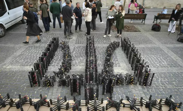 Over 800 FPV drones placed in the shape of Ukraine's state emblem, the trident, are seen in central Lviv, western Ukraine, Friday, May 10, 2024. Lviv volunteers have handed over nearly 7 300 drones to the Ukrainian army over the year in the frame of project "Birds of Victory". (AP Photo/Mykola Tys)
