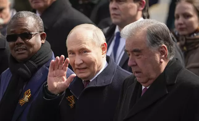 President of the Republic of Tajikistan Emomali Rahmon, right, and Russian President Vladimir Putin, front center, leave Red Square after the Victory Day military parade in Moscow, Russia, Thursday, May 9, 2024, marking the 79th anniversary of the end of World War II. (AP Photo/Alexander Zemlianichenko)