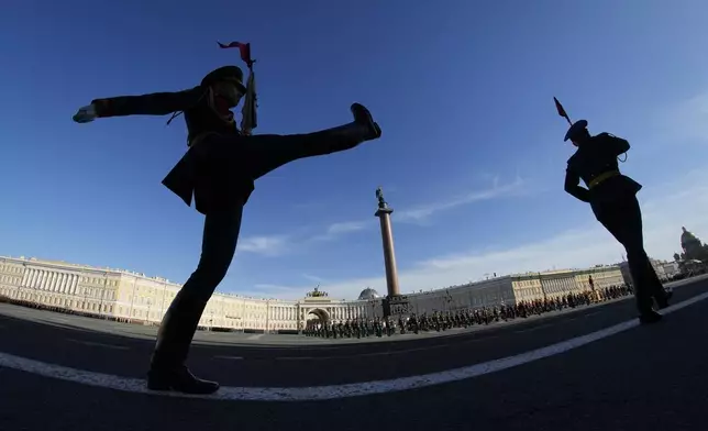Honour guard soldiers march during a rehearsal for the Victory Day military parade which will take place at Dvortsovaya (Palace) Square on May 9 to celebrate 79 years after the victory in World War II in St. Petersburg, Russia, Tuesday, April 30, 2024. (AP Photo/Dmitri Lovetsky)